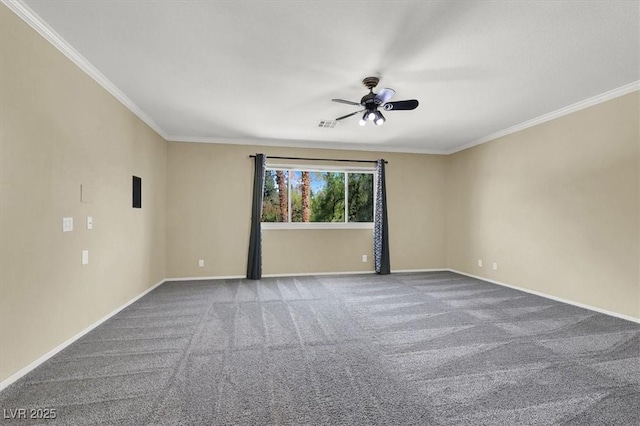 spare room featuring ornamental molding, carpet flooring, and ceiling fan