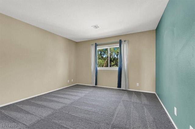 empty room featuring carpet flooring