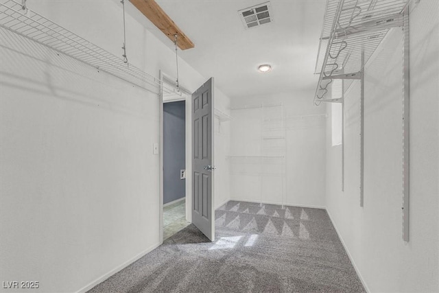 spacious closet featuring dark carpet