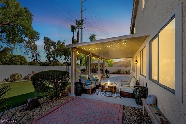 patio terrace at dusk with an outdoor fire pit