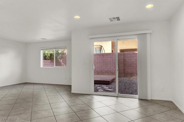 empty room featuring light tile patterned floors