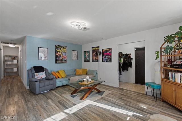 living room with light hardwood / wood-style floors