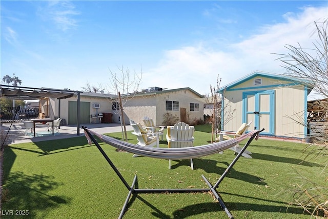 rear view of property with a storage shed, a patio, a yard, and a pergola