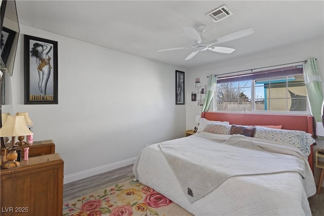 bedroom with hardwood / wood-style floors and ceiling fan