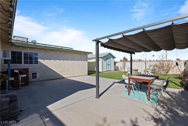 view of patio / terrace featuring a shed