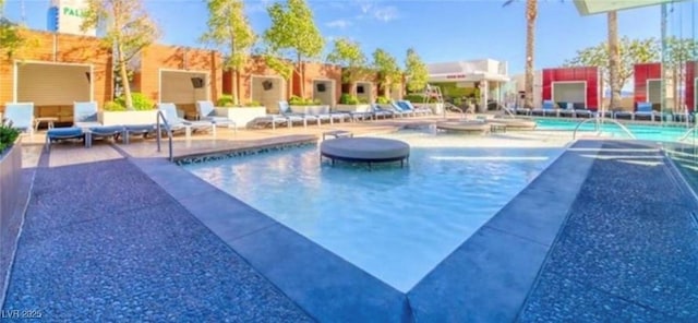 view of pool featuring a patio area