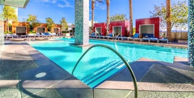 view of swimming pool featuring a patio area