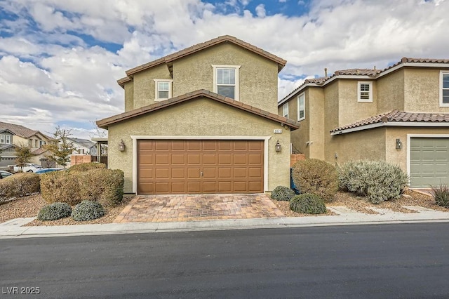 front of property with a garage