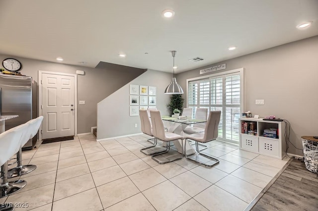 dining area with light tile patterned floors