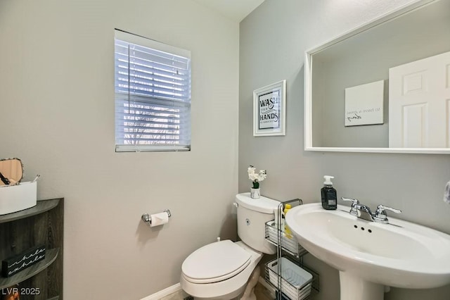 bathroom with sink and toilet