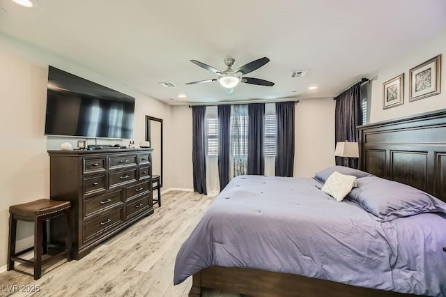 bedroom featuring ceiling fan and light hardwood / wood-style flooring