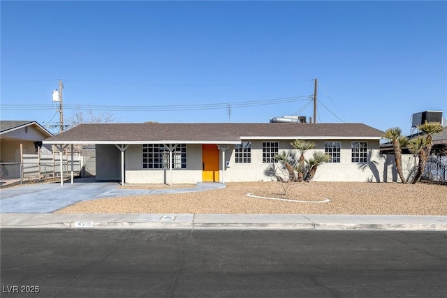 single story home with a carport