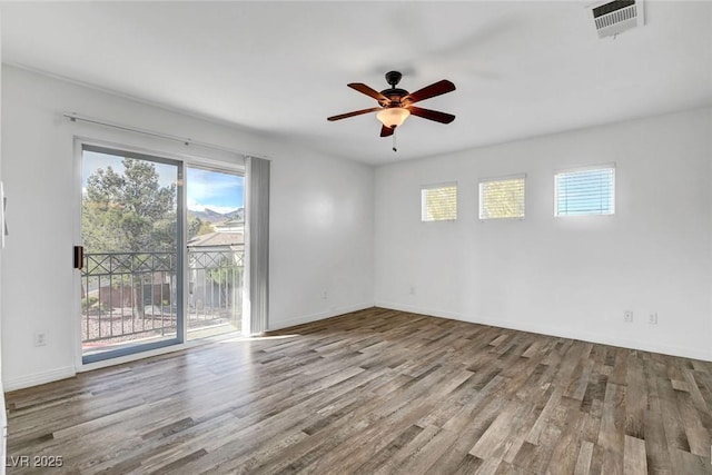 empty room with ceiling fan and light wood-type flooring