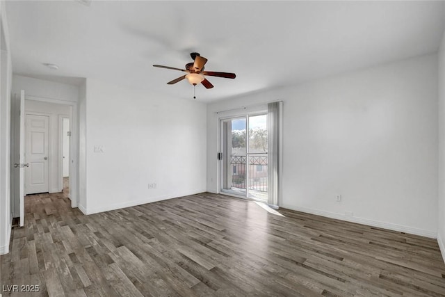 spare room with hardwood / wood-style flooring and ceiling fan