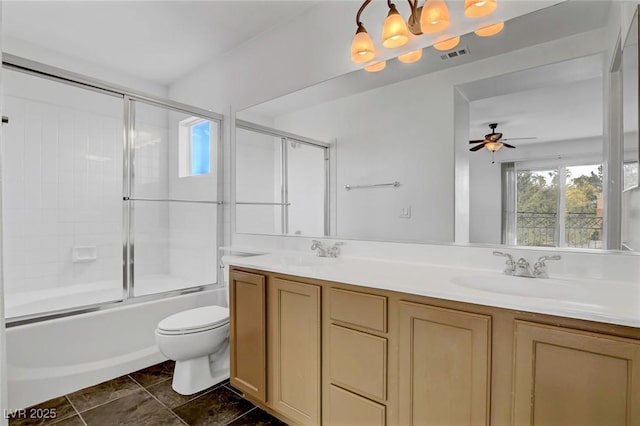 full bathroom featuring vanity, toilet, combined bath / shower with glass door, and an inviting chandelier