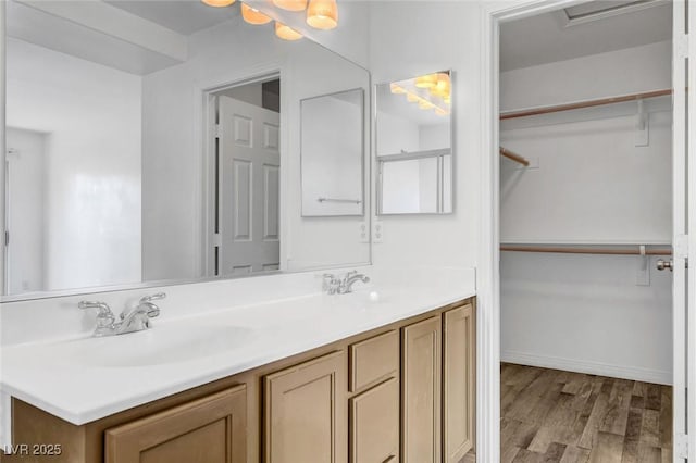 bathroom with hardwood / wood-style flooring and vanity