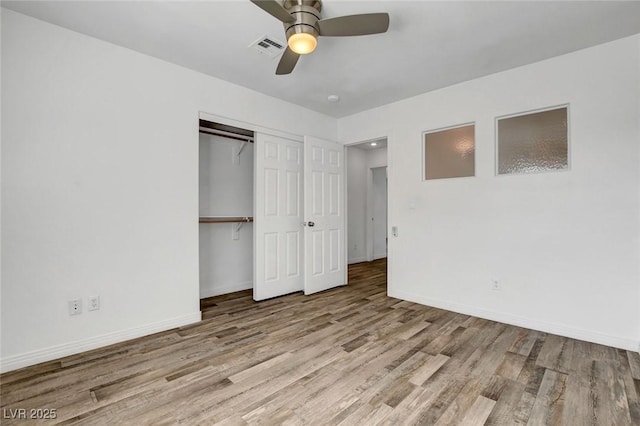 unfurnished bedroom with ceiling fan, a closet, and light hardwood / wood-style flooring