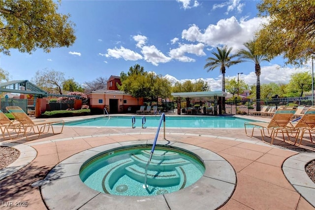 view of pool featuring a gazebo and a hot tub