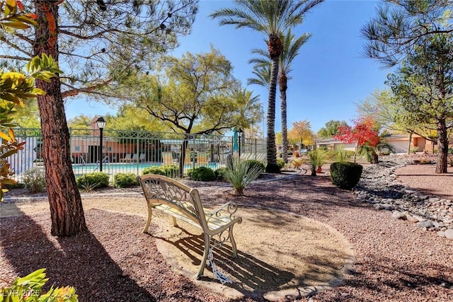 view of yard featuring a community pool