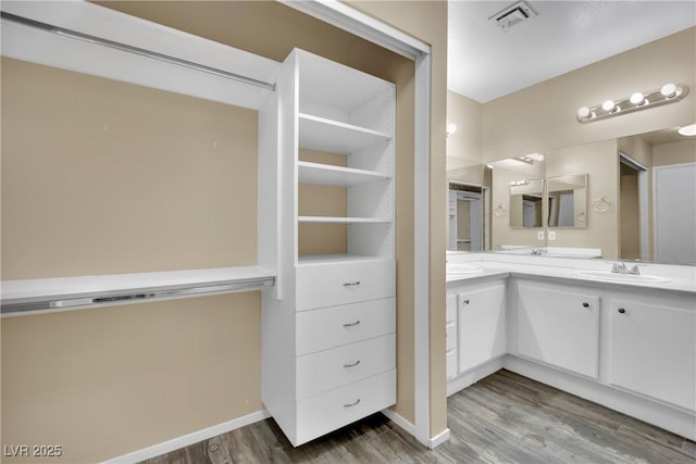 bathroom featuring vanity and hardwood / wood-style flooring