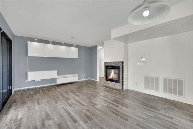 unfurnished living room with light wood-type flooring