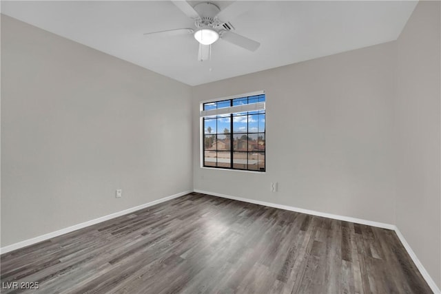 unfurnished room with ceiling fan and dark hardwood / wood-style flooring