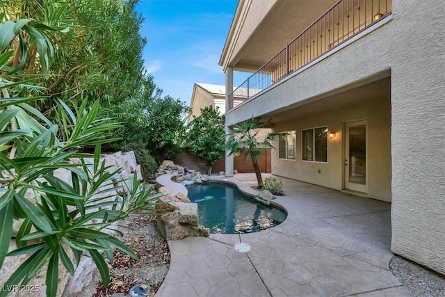 view of swimming pool with a patio