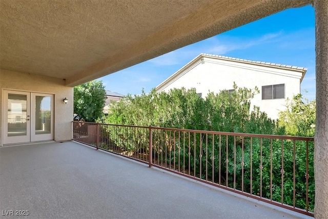 balcony featuring french doors