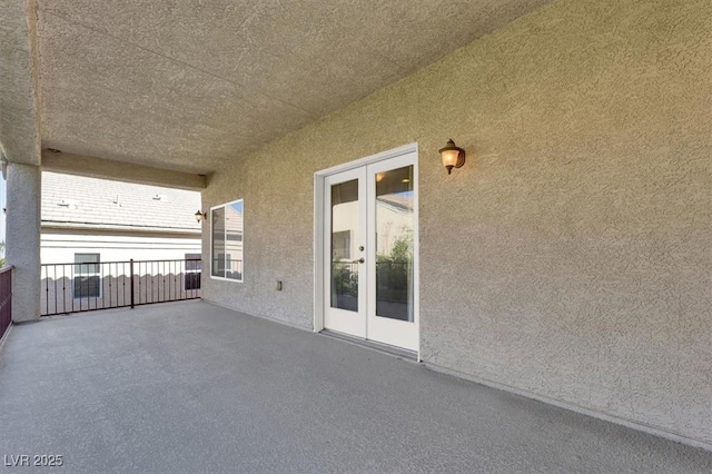 view of patio / terrace featuring french doors and a balcony