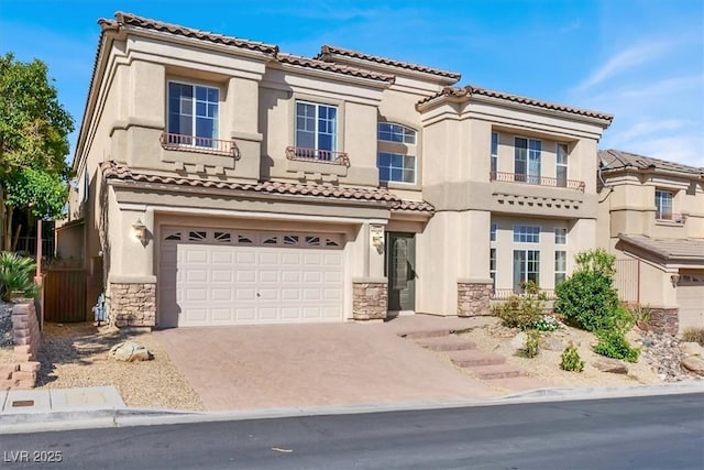 mediterranean / spanish-style home featuring a garage