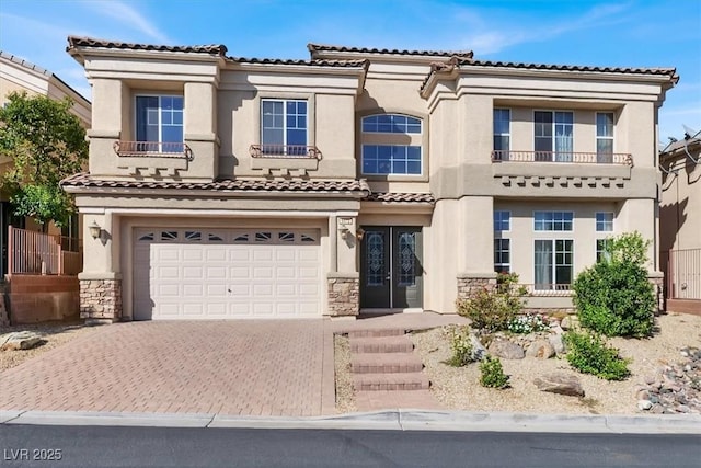 mediterranean / spanish-style home featuring a garage