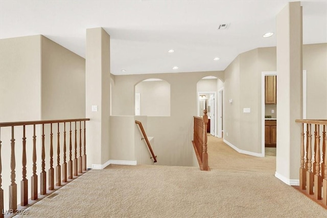 hallway with light carpet