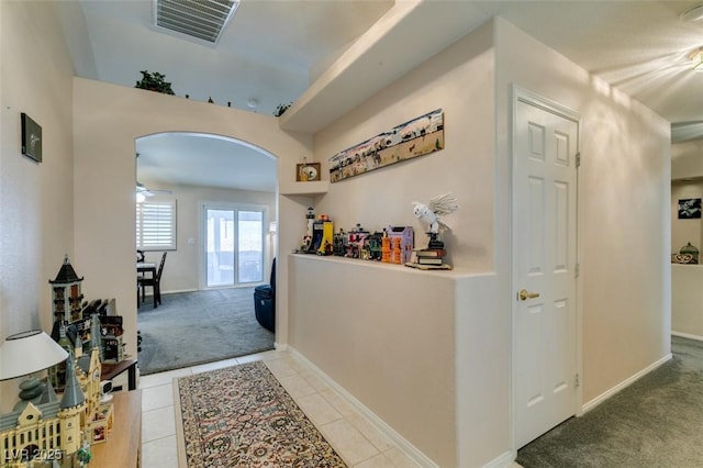 hallway with light carpet