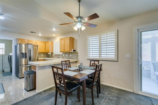 dining room featuring washing machine and dryer and plenty of natural light