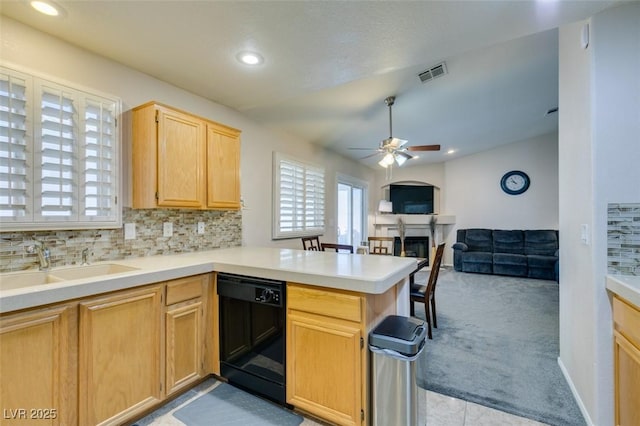 kitchen with dishwasher, sink, backsplash, kitchen peninsula, and light carpet