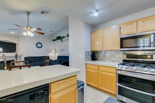 kitchen featuring light tile patterned flooring, appliances with stainless steel finishes, tasteful backsplash, ceiling fan, and light brown cabinets