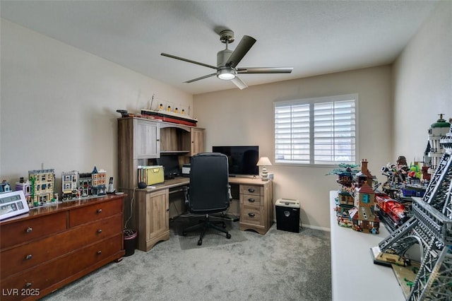 office with ceiling fan and light carpet