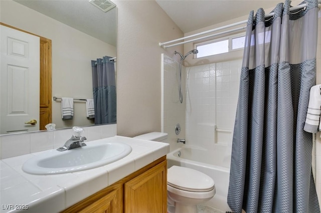 full bathroom with shower / tub combo, vanity, and toilet