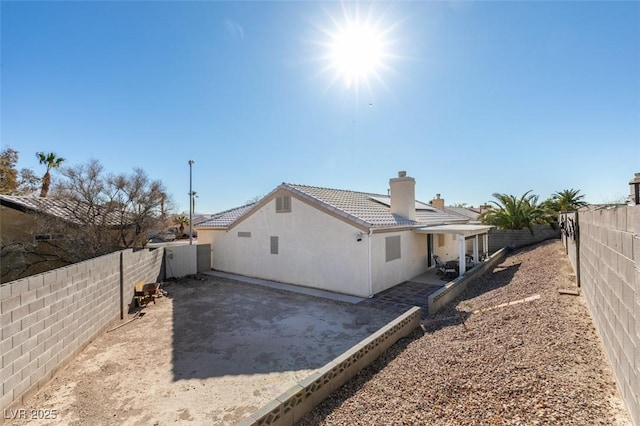 rear view of house featuring a patio area