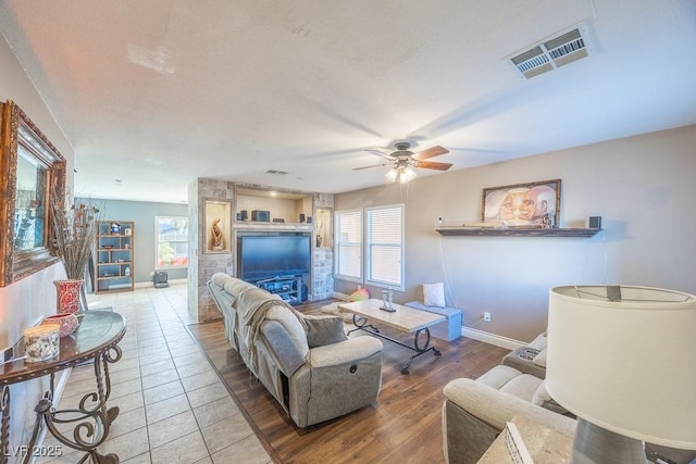 living room with hardwood / wood-style floors and ceiling fan