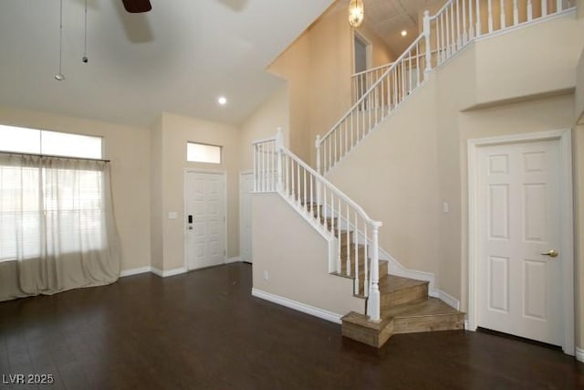 foyer with high vaulted ceiling, dark hardwood / wood-style floors, and ceiling fan