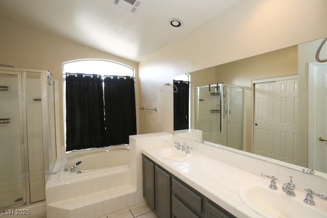 bathroom featuring lofted ceiling, plus walk in shower, tile patterned flooring, and vanity