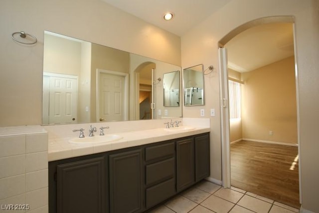 bathroom with tile patterned flooring and vanity