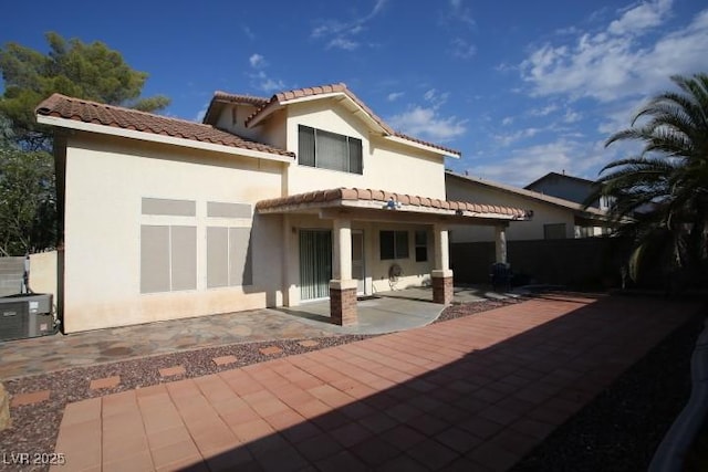 back of house with a patio