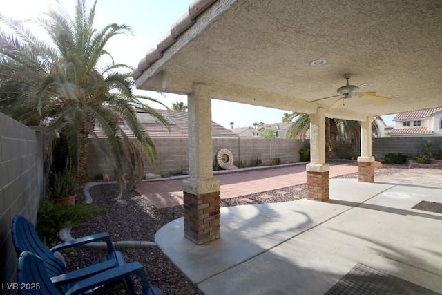 view of patio featuring ceiling fan