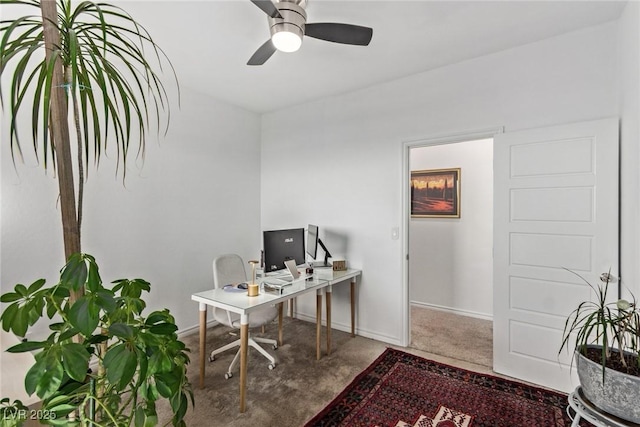 office area with ceiling fan and carpet