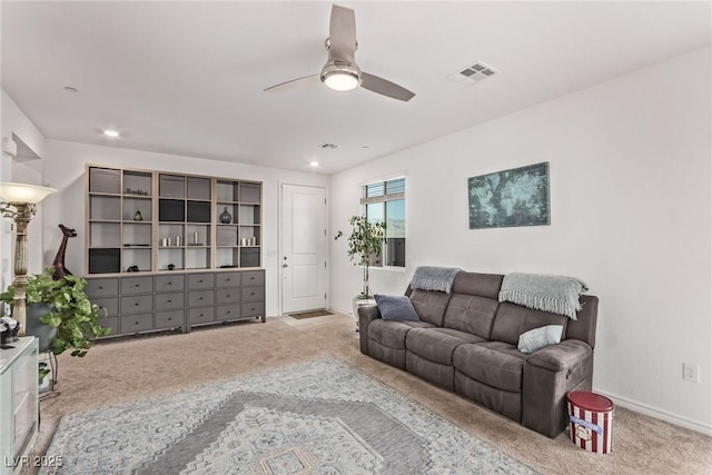 living room with light carpet and ceiling fan