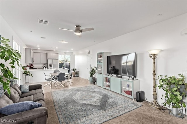 living room with ceiling fan