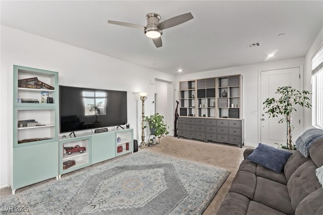 living room with carpet and ceiling fan