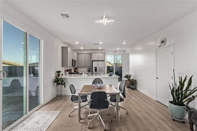 dining room featuring light wood-type flooring